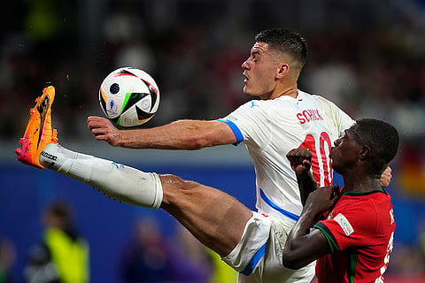 Patrik Schick tussles for the ball with Nuno Mendes 